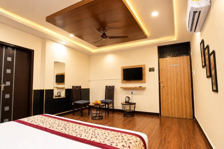 Super Deluxe Room with wooden ceiling and seating area, Hotel Kasol Heritage Lucknow